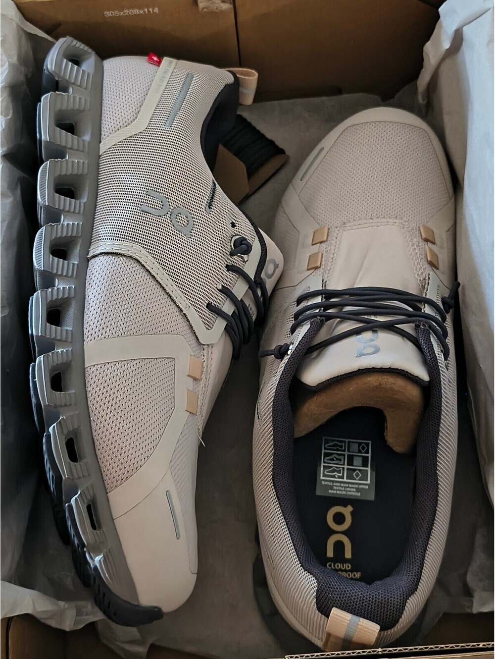On Cloud 5 Waterproof sneakers in an off-white colorway,